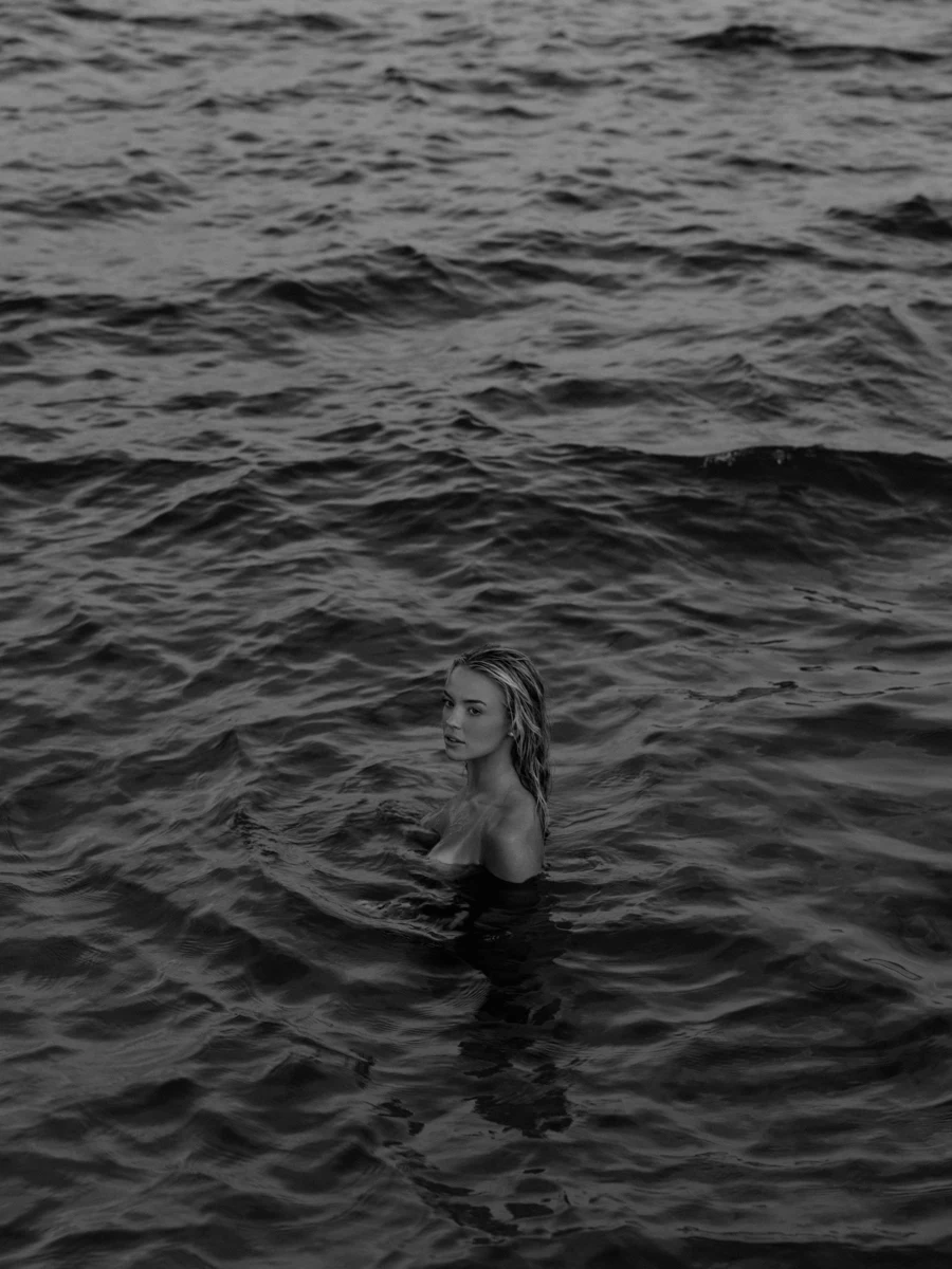 Sophia Benz in the water, photographed in black and white